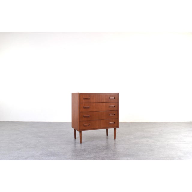 This Danish chest of drawers from the 1960s is an example of Mid-Century Modern design, which emphasized proportion,...