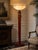A spectacular Empire floor lamp by Infinity Furniture Import, combining monumental scale with richly executed Neoclassical...