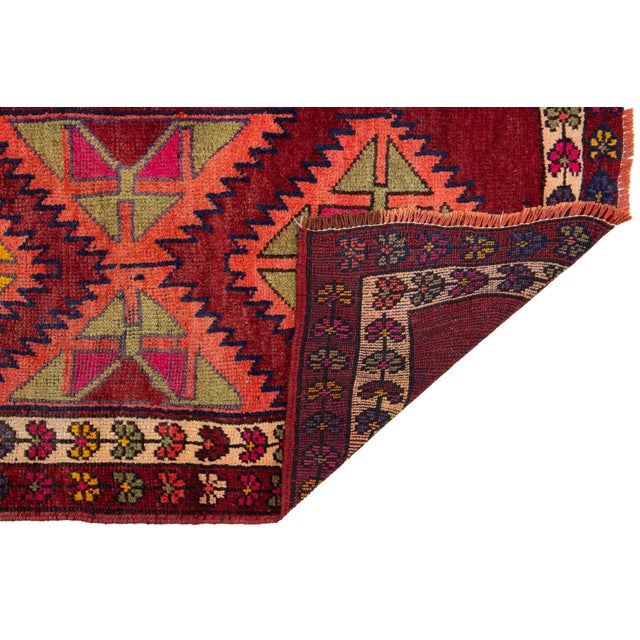 This striking hand-knotted Vintage Persian Hamadan runner features a bold sequence of geometric diamond medallions in a...