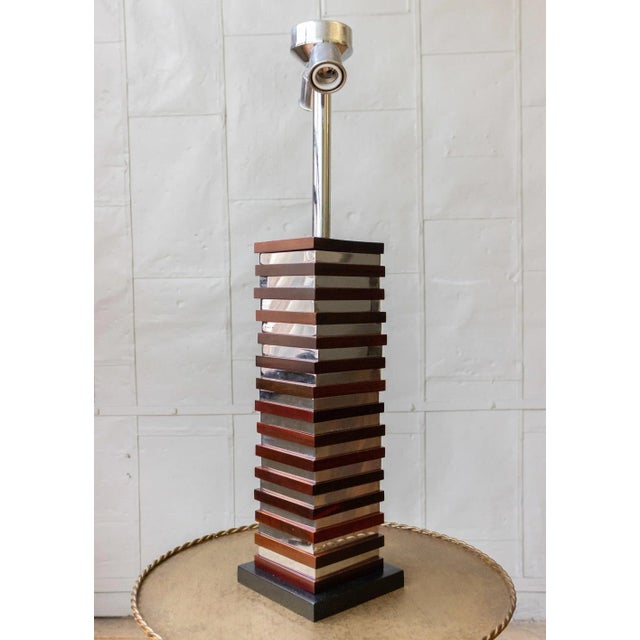 This unusual pair of 1970s French Mid-Century Modern table lamps will enhance any space. These elegant lamps feature...