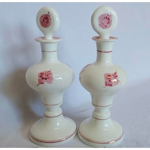 A beautiful matched pair of antique Bohemian opaline milk glass perfume bottles, dating to the late 19th century (circa...