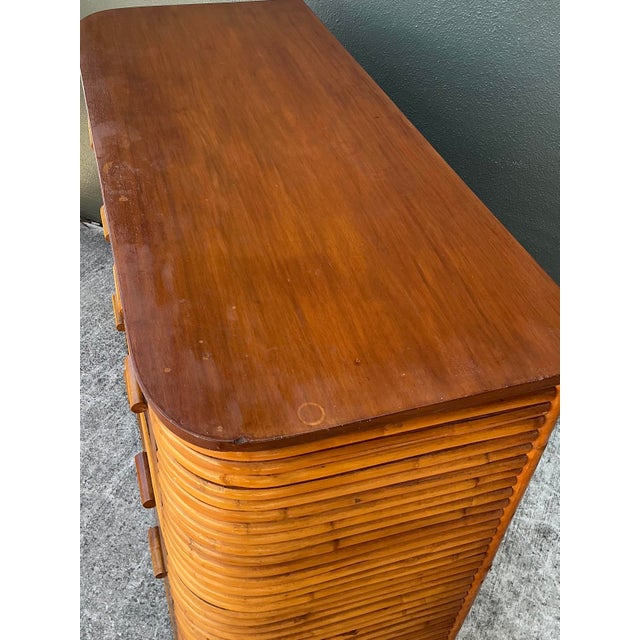 This striking vintage tall chest is an exceptional example of Art Deco revival and Hollywood Regency style, expertly...