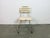 This beige chair was made in former Czechoslovakia during the 1960. It features an iron construction and a wooden seat and...