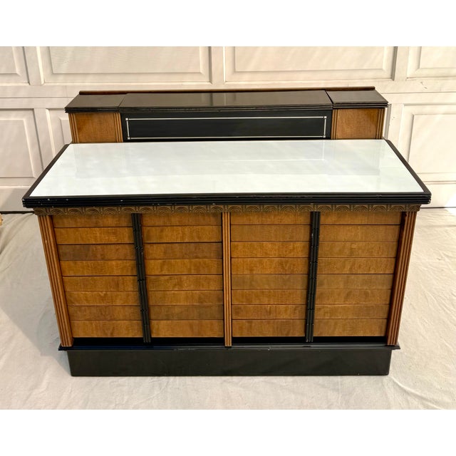 This vintage Art Deco cabinet was produced by The American Cabinet Company in the United States, likely dating to the...
