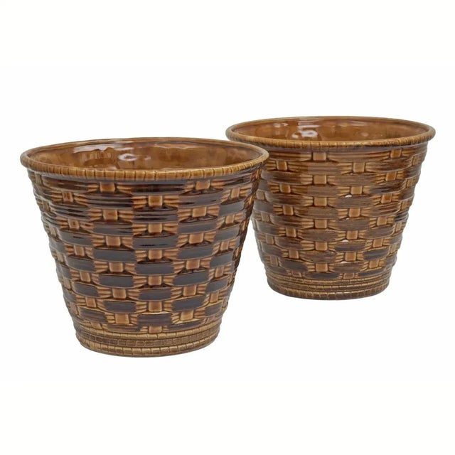 Rare pair of vintage French Sarreguemines majolica cachepots in a caramel color with a trompe l'oeil basketweave pattern....