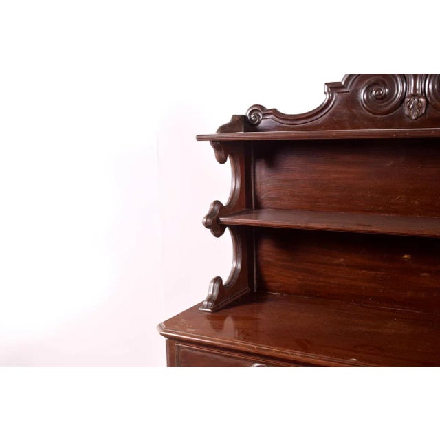 A beautifully carved sideboard or bar cabinet from the late Victorian period. Made in England. with excellent quality....