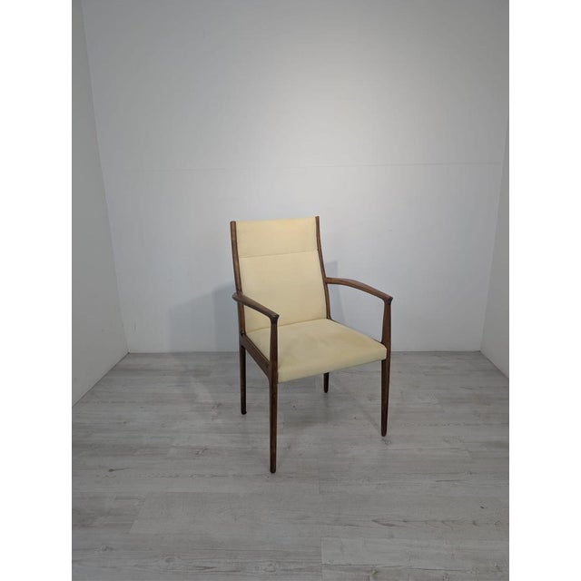 Danish Mid-Century Style Armchair from the 1960s This stylish Mid-Century style armchair from the 1960s is made of wood...