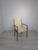 Danish Mid-Century Style Armchair from the 1960s This stylish Mid-Century style armchair from the 1960s is made of wood...