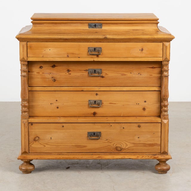 19th century Danish chest of four drawers, crafted in pine with a warm wax finish that enhances the natural aged patina of...