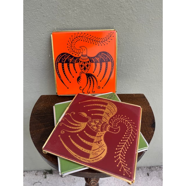A striking collection of square glazed ceramic tiles bearing the artist's stamp on the reverse acquired directly from an...