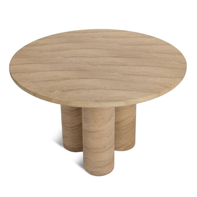 Modern sculptural round dining table made from glass fiber reinforced concrete - perfect for outdoor use. Organic stone-...
