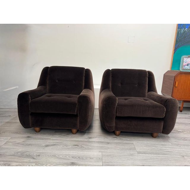 A gorgeous pair of Italian lounge chairs C1970 beautifully crafted with great design and quality. Buttoned seat and...