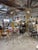 A pair of massive hand crafted brutalist sculptures with sun/star burst mirrors on top. They are each welded and bent...