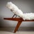 A spacious mid-century wooden daybed featuring an adjustable headrest and elegantly tapered legs. Recently reupholstered...