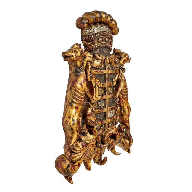 Good quality gilt coloured coat of arms. central shield with acanthus decoration, flanked either side by outward facing...