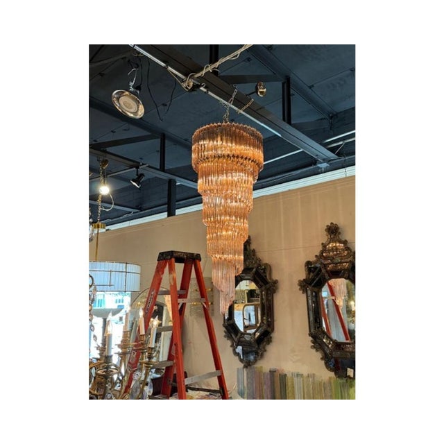 Gorgeous modern Murano pink glass spiral waterfall chandelier. Circa 2000. The chandelier has been professionally rewired,...