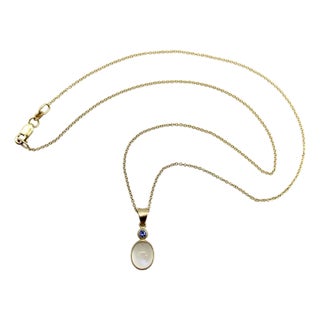 1990s 14k Gold Moonstone Cabochon and Sapphire Pendant Necklace For Sale