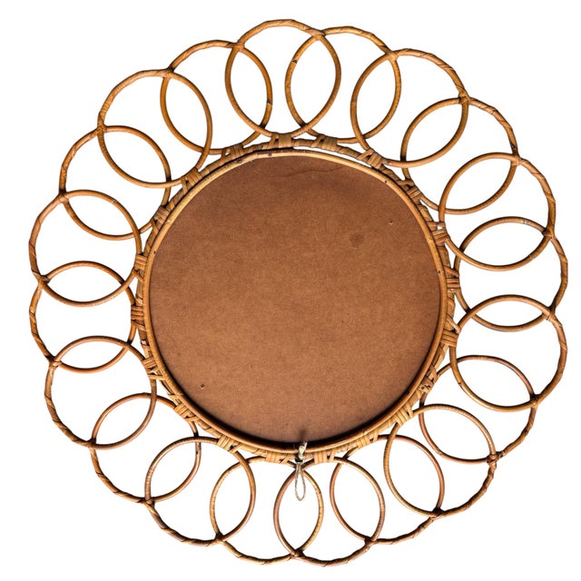Beautiful round rattan mirror from the 1950s. Handcrafted in the south of France.