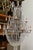 Large Empire style crystal chandelier. 12 light with up to 60 watt bulbs each.