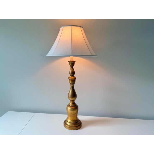 Vintage antique gilt wood gold tall candlestick lamp with white linen shade The gilt wood is in lovely condition with...