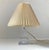 A stylish architecturally perceived small table light from ursula glasbruk in sweden, circa 1960s. Its base is fashioned...