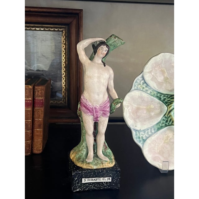 Staffordshire figures of St. Sebastian as well as Elija and the Raven, both made in England in the early 1800's. St...