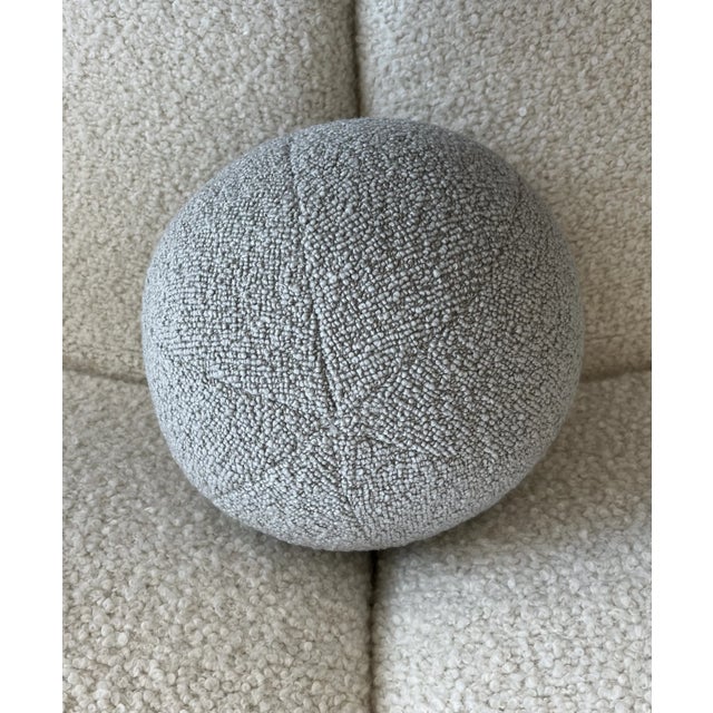 Ball pillow in Dedar Milano's Karakorum boucle in the color Perla, which is a pale gray and one of the most luxurious and...
