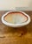 A striking vintage Italian Murano art glass bowl featuring a layered cased white interior suspended beneath thick clear...