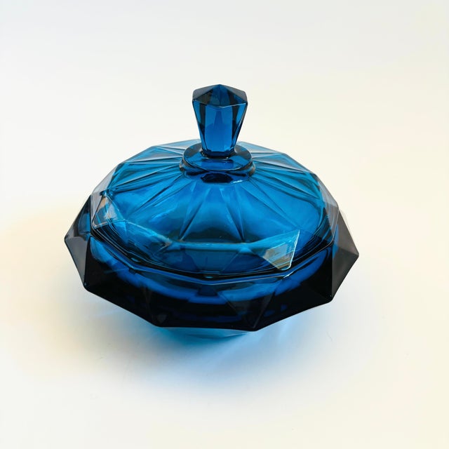 A mid century Viking Glass Bluenique diamond point lidded bowl. Made of thick glass in a circular faceted design. Vibrant...
