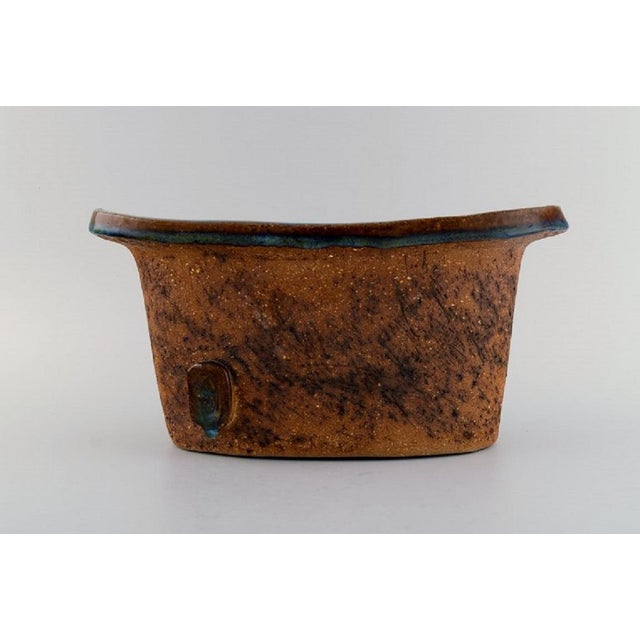 Curt M. Addin (1931-2007) for Glumslöv. Large freeform vase in partially glazed stoneware. Beautiful speckled glaze in...