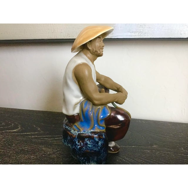 Glazed clay ceramic Chinese man figurine. Perfect condition.