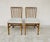 Elegant and timeless, these two vintage chairs are distinguished by their gently curved, vertical spindle backs, offering...