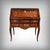 A magnificent Louis XV period marquetry slant-front desk, captivating with its flowing lines, elegance, and the delicate...