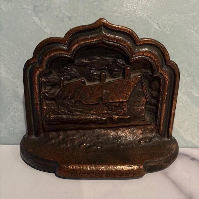 A handsome and substantial pair of bookends, featuring Stratford on Avon, the home of William Shakespeare. Made of bronze.