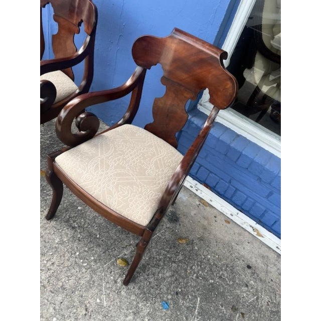 This product is a pair of antique mahogany American scroll arm chairs, fully assembled and handmade in the United States...
