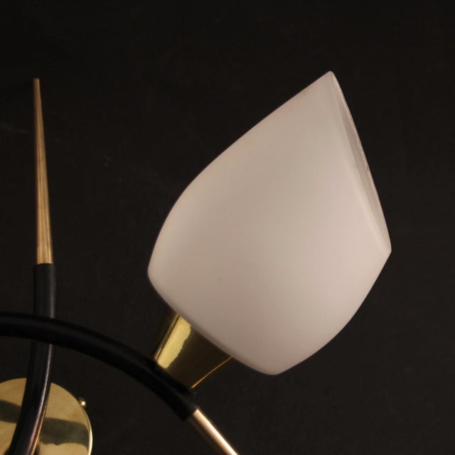 Wall lamp made of solid brass and black lacquered steel with two opal glass bowls. Very nice condition, almost like new....