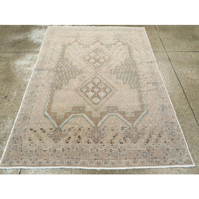 This mid-20th-century Persian Afshar accent rug presents a softly toned geometric composition in ivory, pale beige, sand,...
