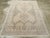 This mid-20th-century Persian Afshar accent rug presents a softly toned geometric composition in ivory, pale beige, sand,...