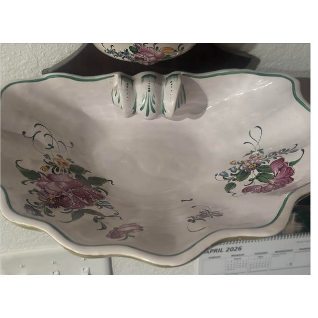 The Lavabo French 19th Century Painted Faience Wall Fountain is a vintage piece that adds a touch of elegance to any room...