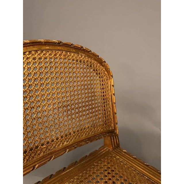 19th Century French Louis XVI Style Gilded Bench With Cane Seat and Side Armrests, Circa 1890 For Sale - Image 10 of 10