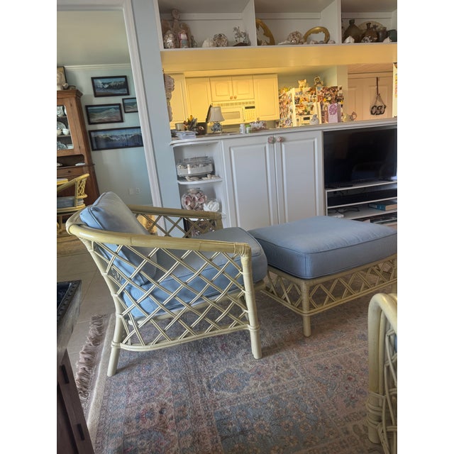 The piece was purchased in 1986. Ficks Reed chair and ottomen distressed pineapple bamboo comes from a set. The arms were...