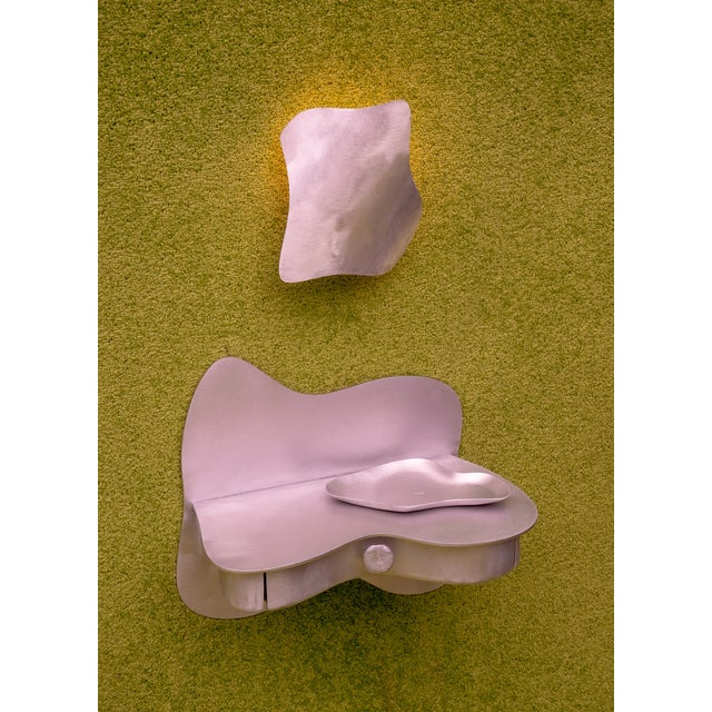 The Dream/Reality Wall Sconce is a sculptural light. Its warm glow creates atmospheric light that reflects off the...
