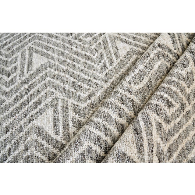 The Eaton rug is hand knotted with a low nubby wool pile with a shimmer of bamboo fiber for highlights. This collection...