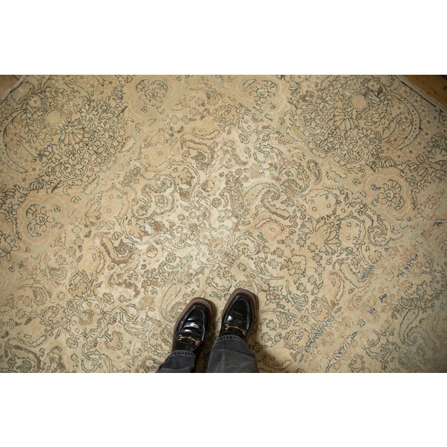 Allover covered field mid century Kerman featuring a densely ornamented main field of floral vines, serrated leaves,...