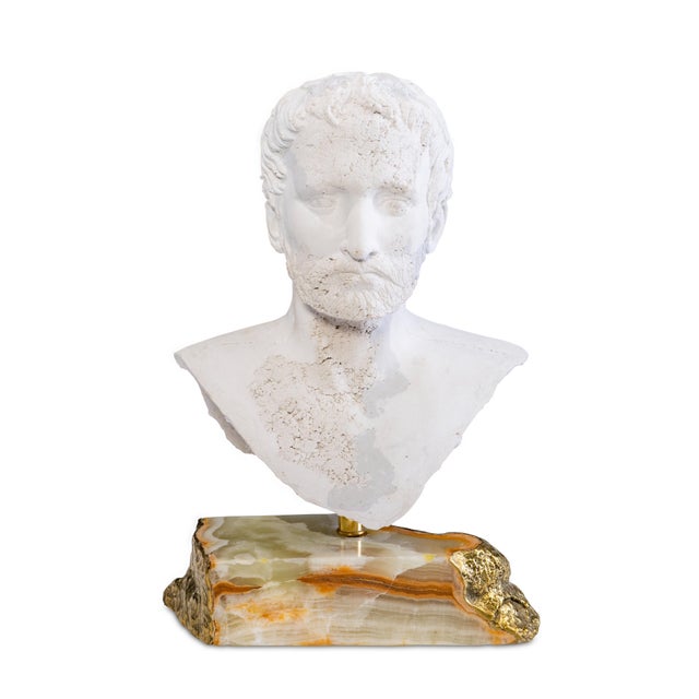 Rendered with timeless precision, this sculptural bust captures the quiet strength of the human form. The finely modeled...