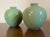 Pair antique early 20th century Chinese monochrome small porcelain vases with celadon glaze. Globular round shape with...