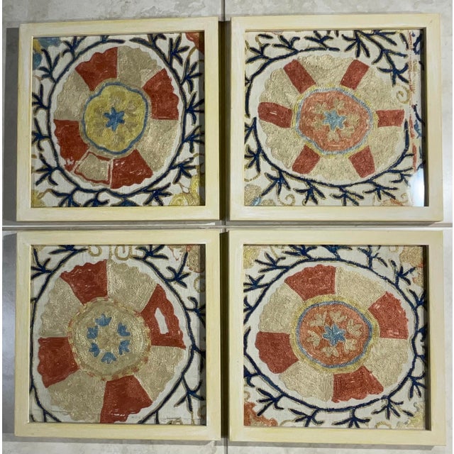This beautiful set of four Suzani embroidery features intricate geometric and floral patterns, showcasing traditional...