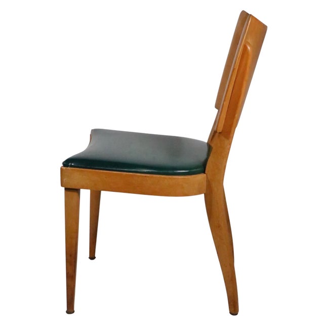 Set of four Mid Century Modern dining chairs, made by the Heywood Wakefield furniture company - model M- 555 A. The chairs...