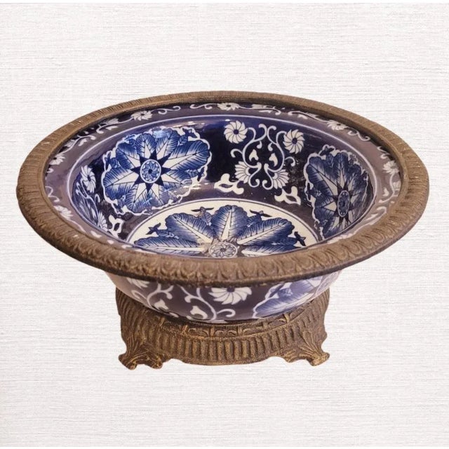A wonderful vintage extremely heavy porcelain blue and white chinoiserie decorative bowl by Bombay Company. The bowl...
