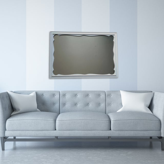 A beautiful mid-20th-century rectangular wall mirror by Ethan Allen with distressed painted finish which enhances its...